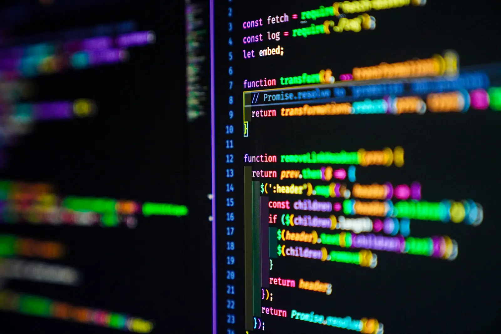 JavaScript functions in colourful syntax highlighting on a dark code editor screen, with line numbers in shallow focus