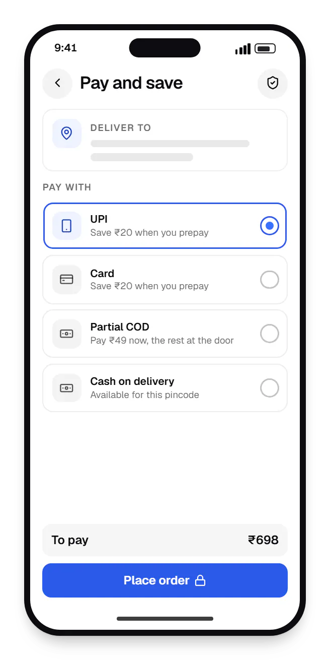 D2C e-commerce brand store checkout on a phone, with UPI, card and partial COD options