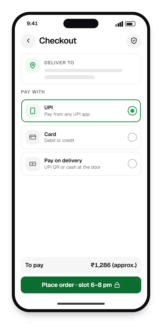 Grocery delivery customer app checkout on a phone, with UPI, card and pay on delivery options